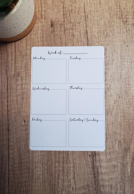 5x7 inch sticker sheet designed for weekly planning. The words week of is printed at the top with a blank line for you to fill in the date. Below, each day of the week is listed, starting with Monday and ending with Saturday and Sunday sharing a single box, each accompanied by a 2.35x1.69 inch blank box for you write in.